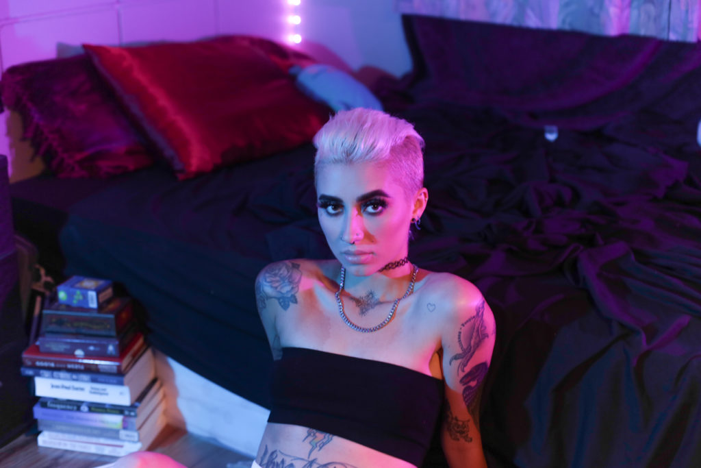 models in motels with blue and purple light